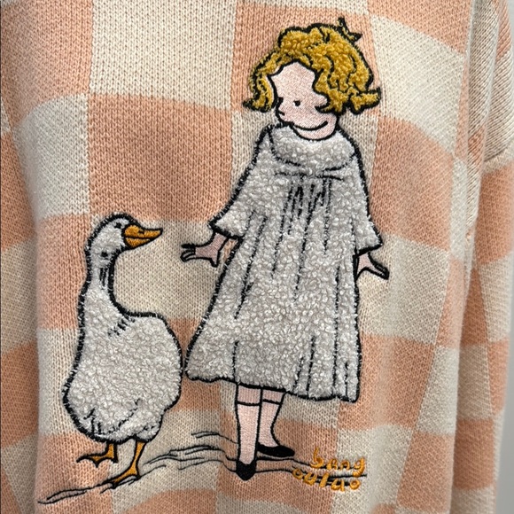 Peach Checkered Sweater with Girl and Goose Design - Picture 2 of 10